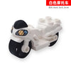 White building block set featuring a vehicle and trailer model.