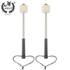 A pair of professional wool felt bass drum mallets with non-slip metal handles and black straps.