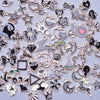 Assortment of gold-tone enamel charms for jewelry making featuring various shapes and designs