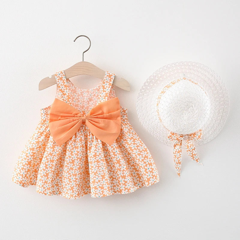 A baby girl summer dress and sunhat set featuring an orange floral print and bow details.