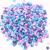 A pile of colorful polymer clay flower charms in various shades of pink, blue, and purple.