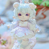 A white collectible figurine of a cat-eared girl with purple eyes and pink accents.
