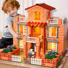 A child is interacting with a detailed orange brick miniature house model set.
