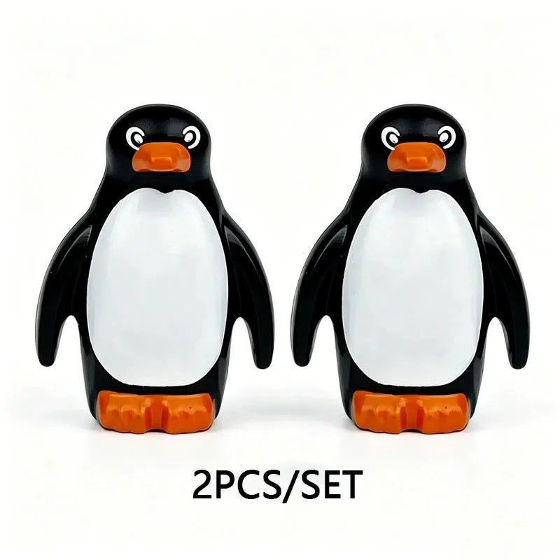 A set of two black and white penguin marine animal building blocks