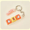 A pink Miffy keycap pendant attached to a silver keyring, displayed on a light background.