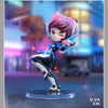 A collectible PVC figurine of a female character with pink hair and blue armor holding a futuristic weapon.