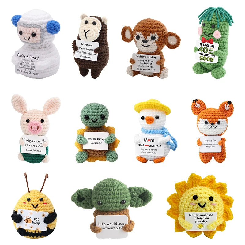 A collection of handmade crochet pocket hug dolls featuring various animal characters and inspirational slogans.