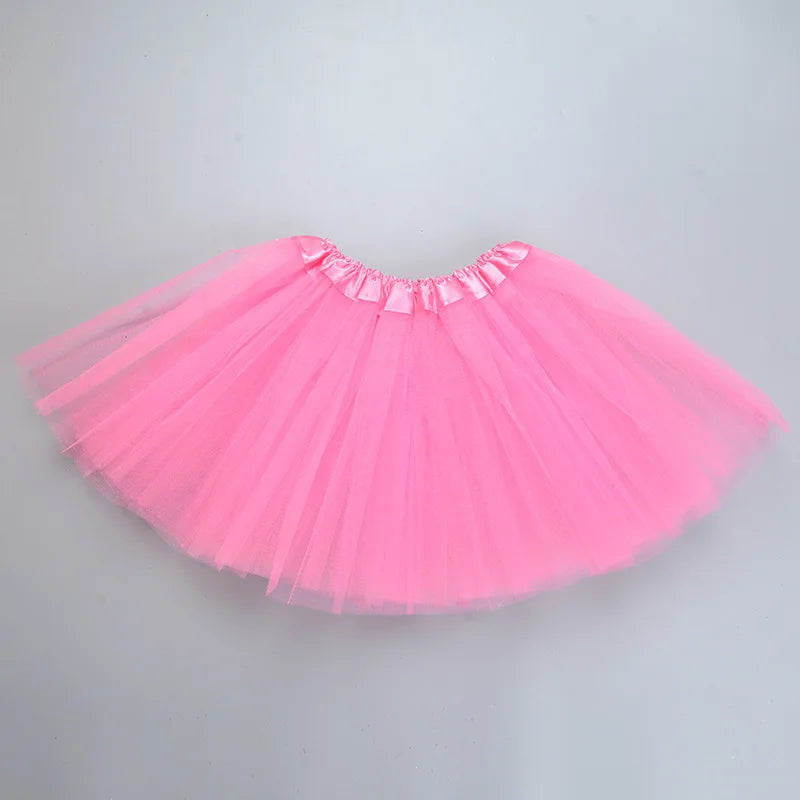 A bright pink three-layer tutu skirt for girls with a ruffled waistband.