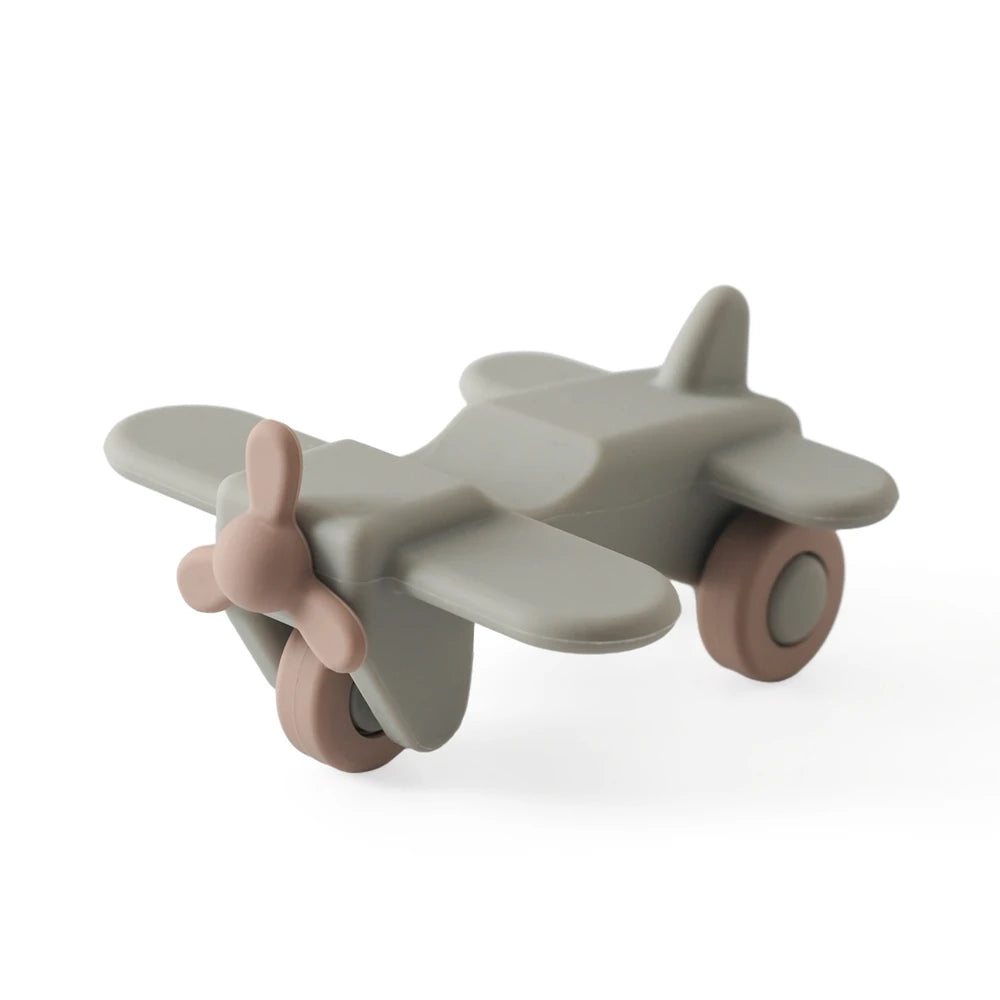 A gray silicone toy car set with large wheels and a propeller, designed for toddlers.