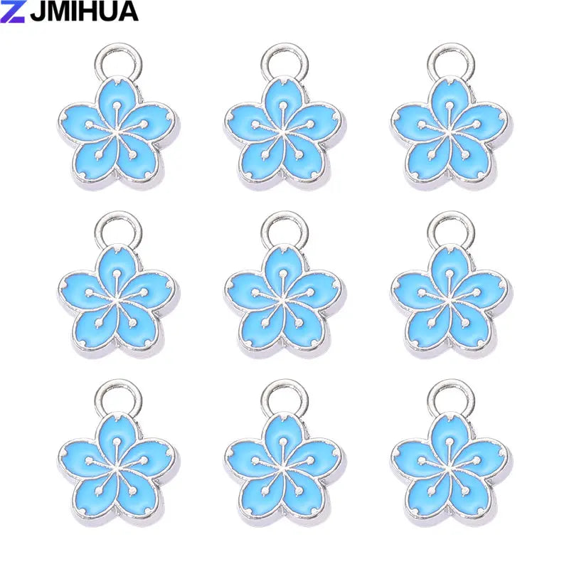 A set of 15 enamel flower and cherry charms for jewelry making in light blue color