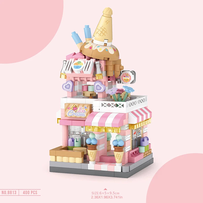 Un ensemble de blocs de construction représentant une devanture de boutique de glace rose avec divers éléments colorés.