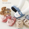 A collection of adorable cartoon bear baby socks and booties in various soft colors like pink, beige, and blue.