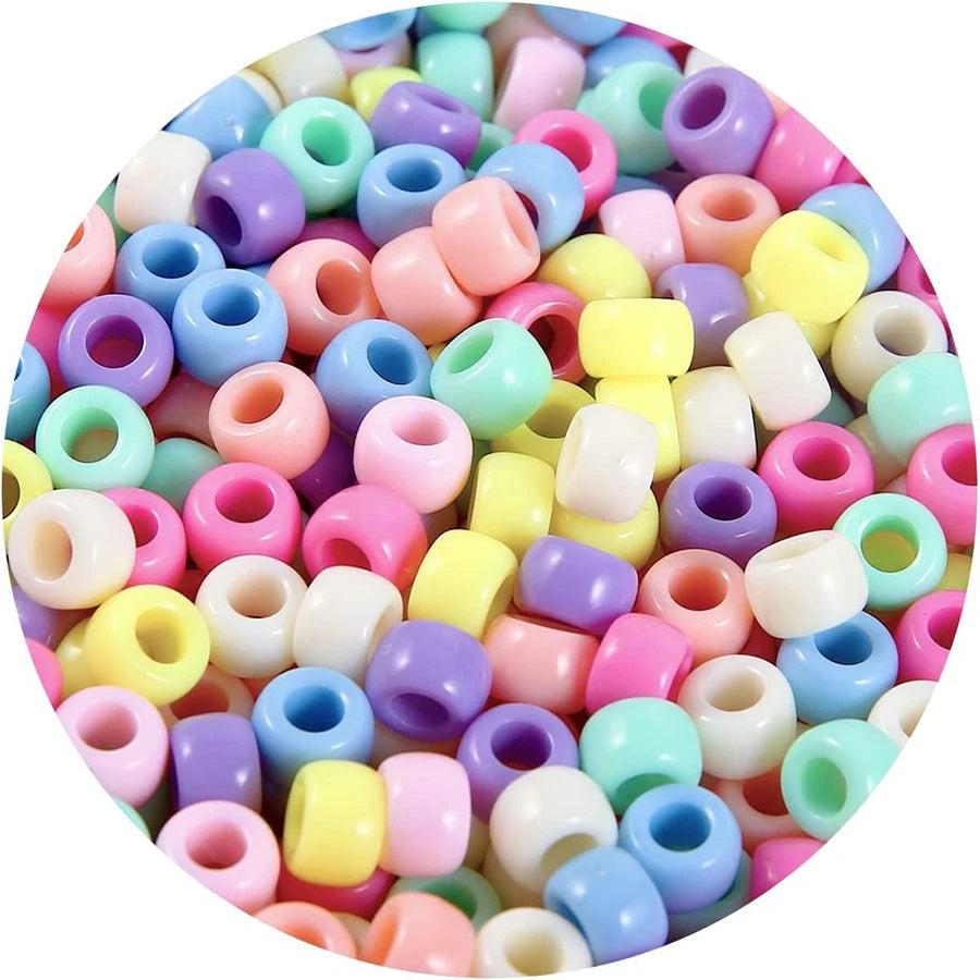 A variety of colorful pony beads in various shapes and sizes are displayed on a circular background.