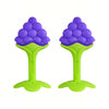 A pair of purple silicone fruit-shaped baby teethers with bright green bases.
