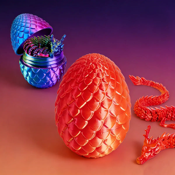 A vibrant red dragon egg and accompanying dragon toy set displayed on a smooth surface.