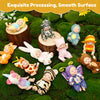 A set of six cute sleeping reborn baby dolls in various poses and outfits resting on green moss.