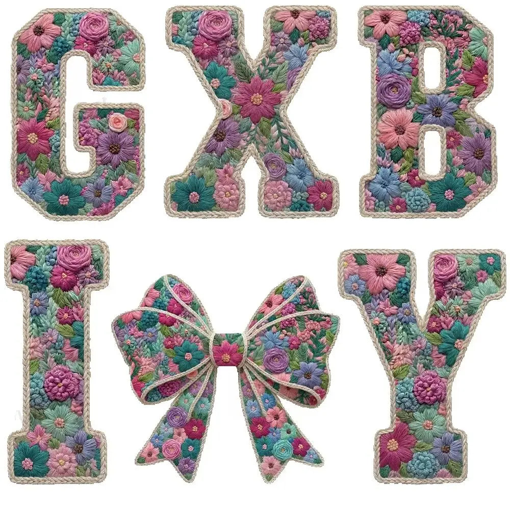 Floral letter patches in various shades of pink, purple, and green with bow accents for DIY clothing