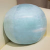A light blue, spherical plush toy used as an educational soft doll for children.