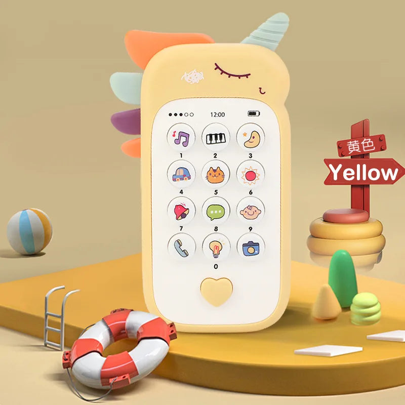 A yellow baby phone toy with a smiling face and various buttons is shown next to a pacifier and teething rings.