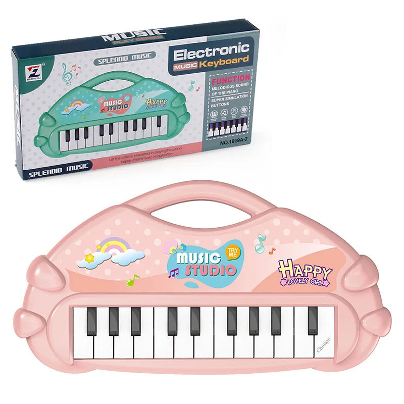 Pink plastic electronic music keyboard toy with black keys and a lid, packaged in a box.