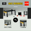 A 1/64 scale model of a garage diorama featuring tools and a parking lot setup.