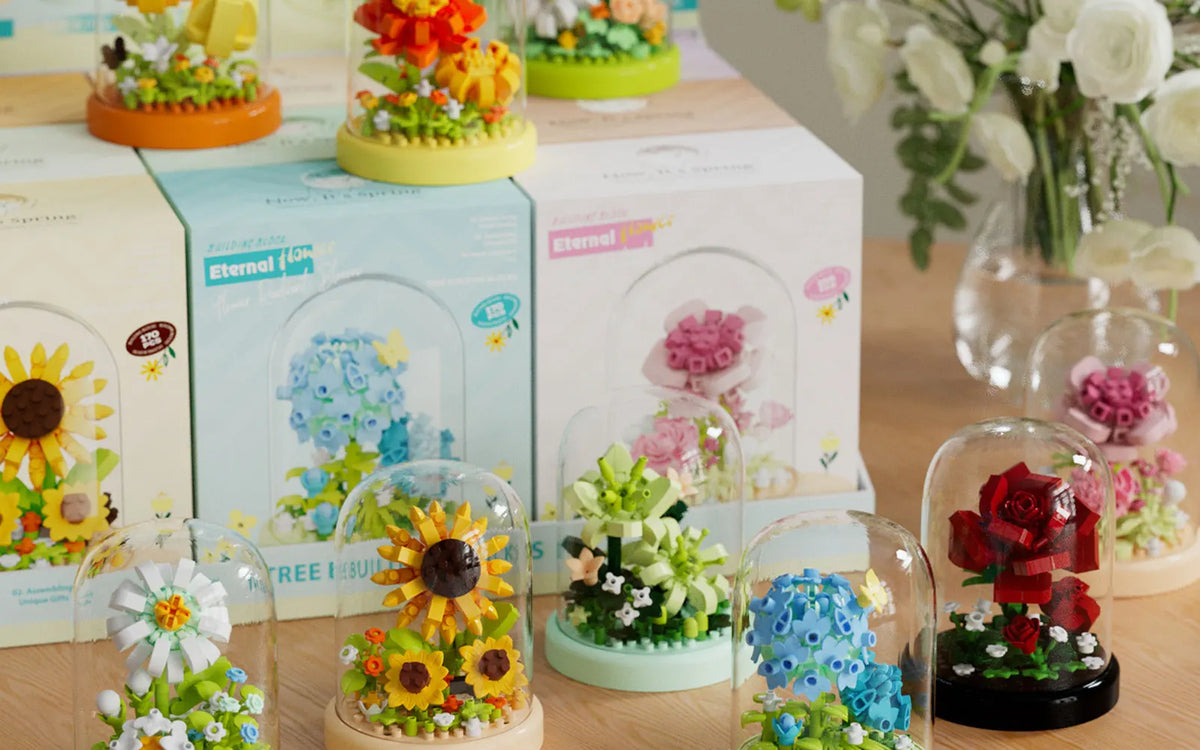 A collection of DIY flower bouquet building blocks in various colors and shapes displayed on a wooden surface.
