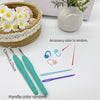 A set of ergonomic crochet hooks, stitch markers, and needles with various colors displayed on a white surface.