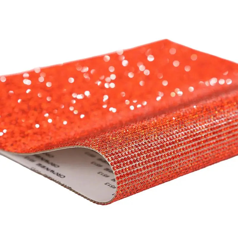 Roll of sparkling red rhinestone adhesive tape for DIY crafts and decor