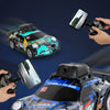 A blue and black remote control racing car with an HD camera mounted on the front, shown in action.