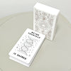 A white box of 60 hand-illustrated oracle cards featuring celestial and nature motifs is displayed next to a stack of cards.