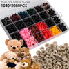 A box of 1040 or 2080 plastic art eye and nose buckles for dolls and stuffed animals, with several plush toys visible.