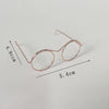 A pair of rose gold metal round glasses frames shown with dimension lines.