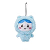 A light blue fluffy plush keychain featuring a face design with blue hair and pink cheeks.