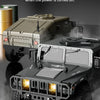 A dark military-style RC off-road climbing vehicle with flashing lights in synchronization.