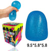 A hand is squeezing a bright blue squishy ball, demonstrating the size and texture of the stress relief toy.