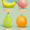 Three fruit-shaped puzzle cubes: a yellow banana, a pink pumpkin, and a green pear.