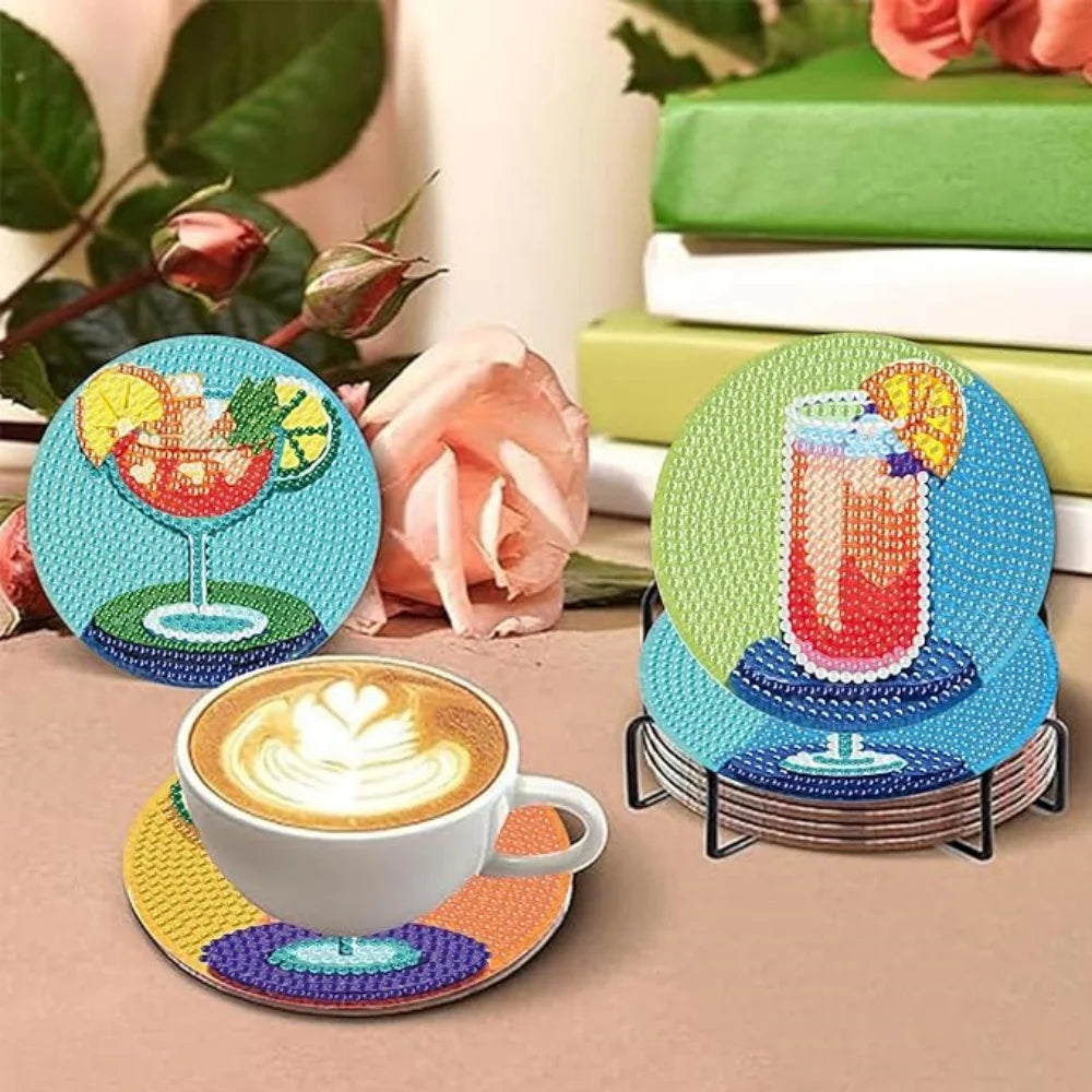 A set of colorful DIY diamond art coasters featuring fruit and floral designs with a holder.