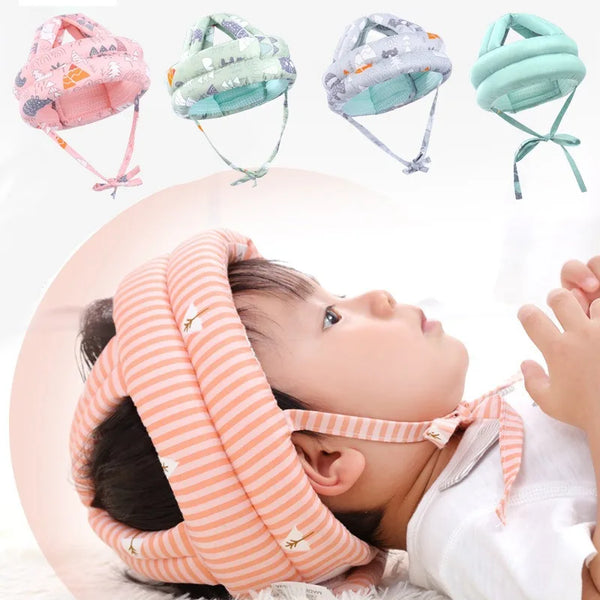 A toddler is wearing an orange and white striped mesh safety helmet for protection.