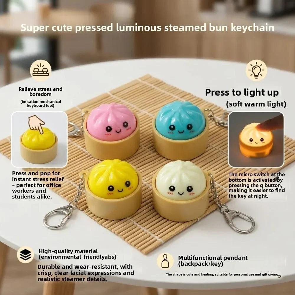 A set of super cute pressed luminous steamed bun keychains in various colors resting on a bamboo mat.