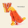 An orange alphabet letter V shaped robot toy figure with a yellow head and body.