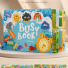 A colorful learning book titled Busy Book featuring alphabet and number recognition pages with interactive stickers.