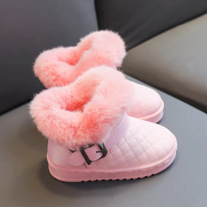 Pink girls snow boots with fluffy pink lining and a crystal bow detail