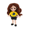 A 16cm articulated BJD princess doll with long brown hair wearing a yellow top and dark shorts.