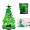 A green crystal growing tree science kit with a magical blooming Christmas decoration in a clear base.