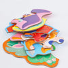 A colorful six-in-one educational puzzle set featuring various fairy tales, animals, and ocean themes cut from cardboard.
