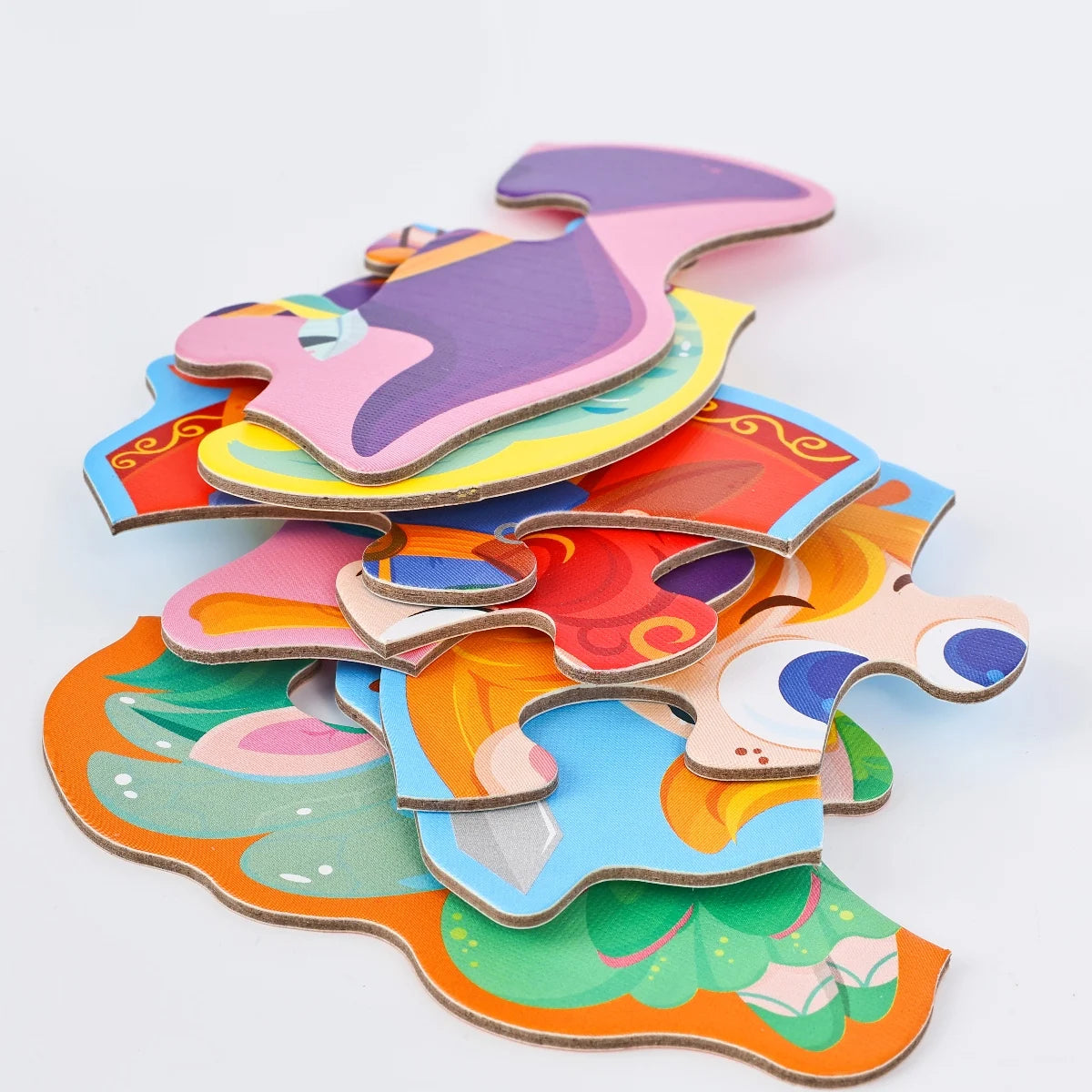 A colorful six-in-one educational puzzle set featuring various fairy tales, animals, and ocean themes cut from cardboard.