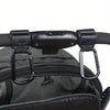 Close-up of black heavy-duty stroller hooks attached to a dark gray fabric bag or carrier.
