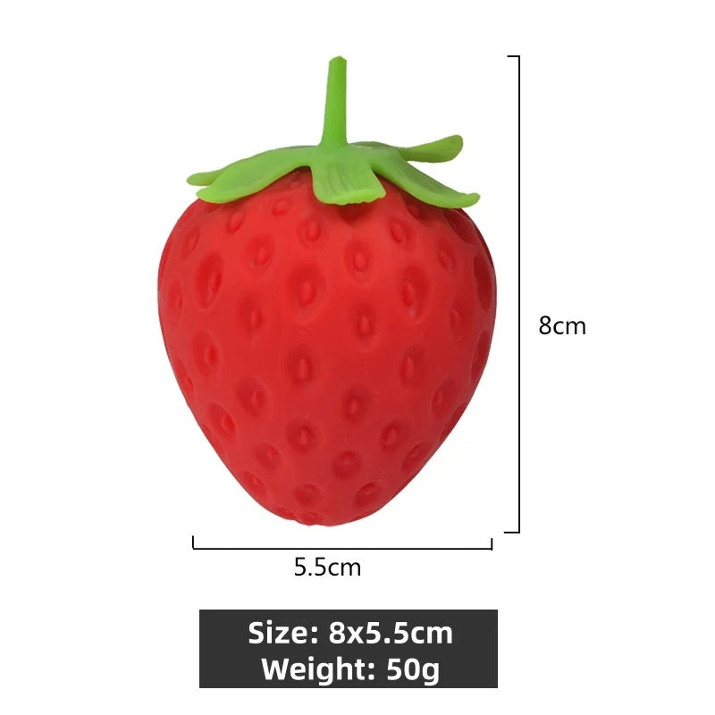 A bright red strawberry fruit squishy stress relief fidget toy with a green leafy top.