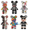 A collection of nine detailed bear figures made from brick-like building blocks in various colors and patterns.
