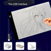 A drawing pad showing a line art of a girl, with a USB interface connection visible.